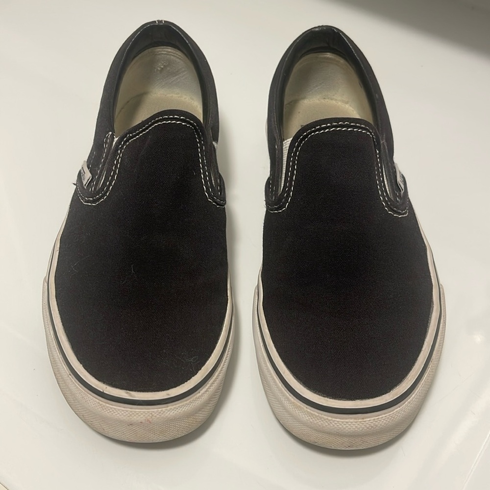 Vans black slip on tennis shoes. Size 7.5